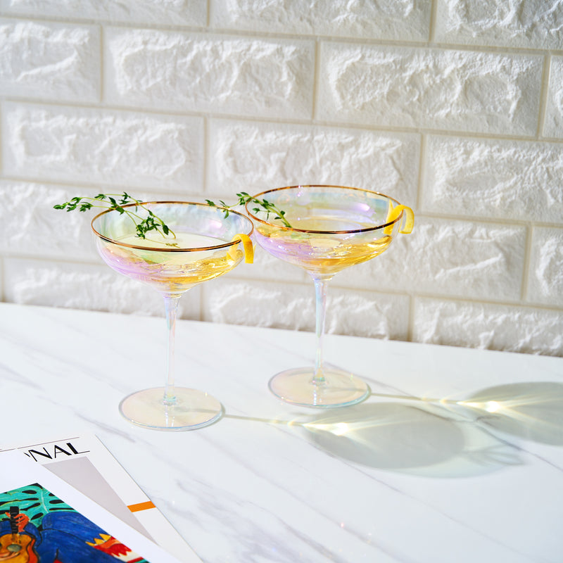 https://www.thewinesavant.com/cdn/shop/files/Gilded-rim-champagne-coupe-in-iridescent_-set-of-2_800x.jpg?v=1698160718