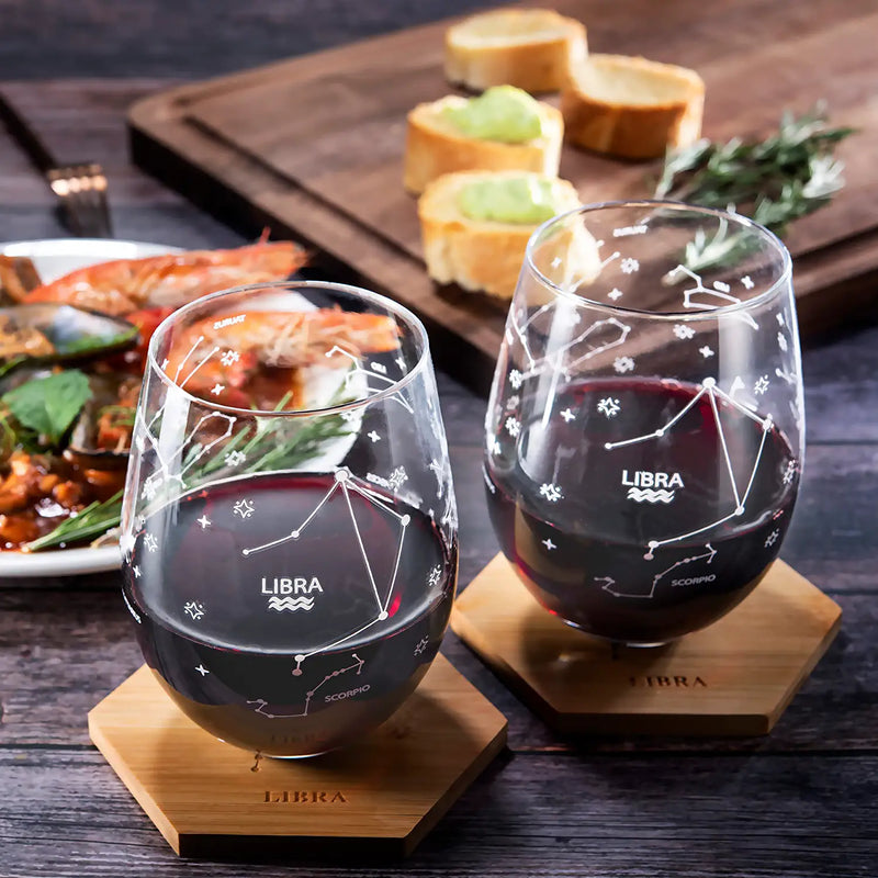 Set of 2 Zodiac Sign Wine Glasses with 2 Wooden Coasters by The Wine Savant - Astrology Drinking Glass Set with Etched Constellation Tumblers for Juice, Water Home Bar Horoscope Gifts 18oz (Libra)